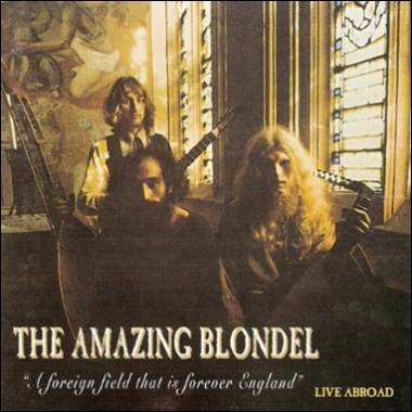 A group of men with long hair and long hair holding guitars
Description automatically generated