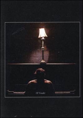 A person sitting at a piano
Description automatically generated