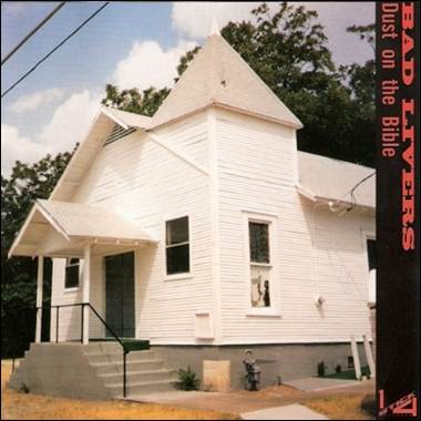 A white church with a triangular roof
Description automatically generated