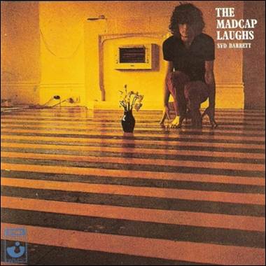 A person kneeling on a striped floor
Description automatically generated