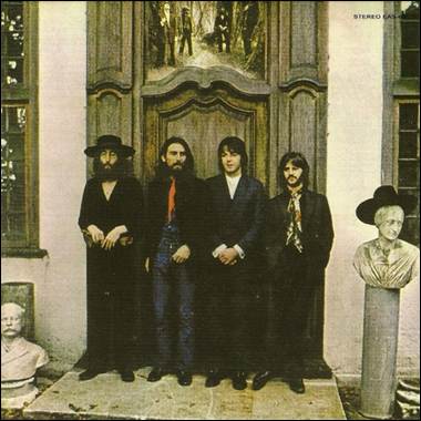 A group of men standing in front of a door
Description automatically generated