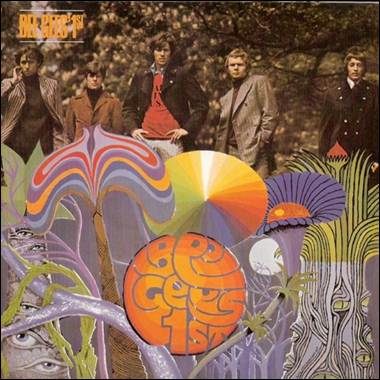 A group of men standing in front of a colorful background
Description automatically generated