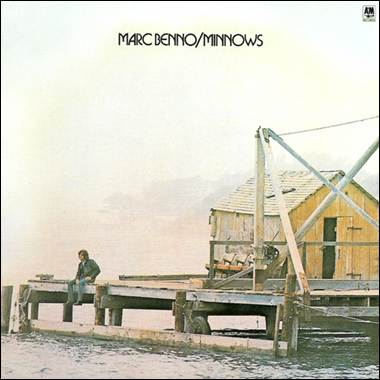 A person sitting on a dock
Description automatically generated