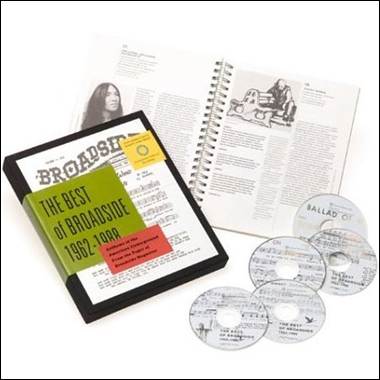 A book and cd's next to a book
Description automatically generated