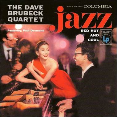 A person in a red dress at a piano
Description automatically generated