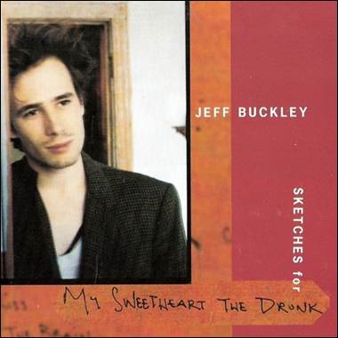 A person standing in front of a red and orange cover
Description automatically generated