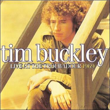 A person sitting on a wooden ladder
Description automatically generated