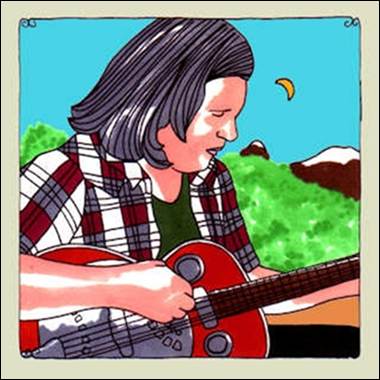 A person playing a guitar
Description automatically generated