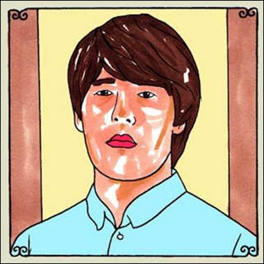 A person with brown hair and red lipstick
Description automatically generated