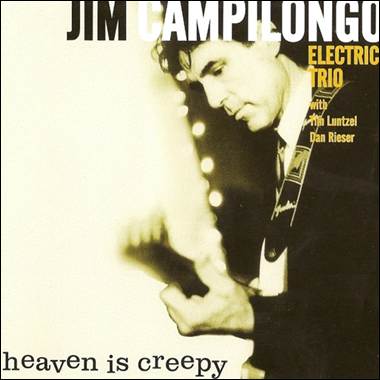 A person holding a guitar
Description automatically generated