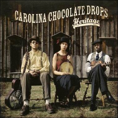 A group of people sitting outside a building

Description automatically generated