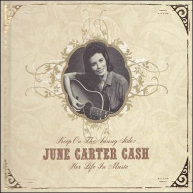 A person holding a guitar
Description automatically generated