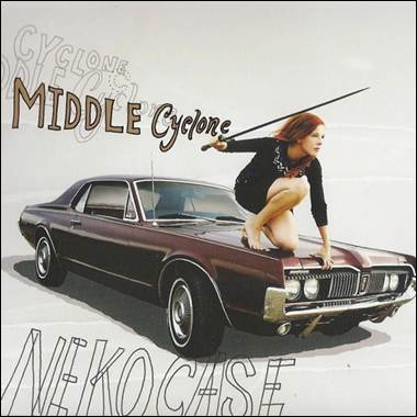 A person holding a sword on a car
Description automatically generated