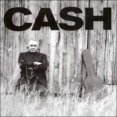 A person sitting in front of a wooden wall
Description automatically generated