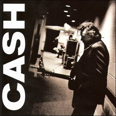 A person holding a guitar
Description automatically generated