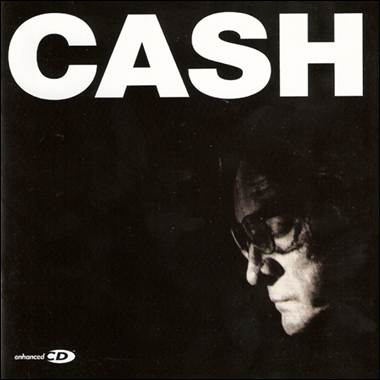 A person wearing glasses and a black background
Description automatically generated