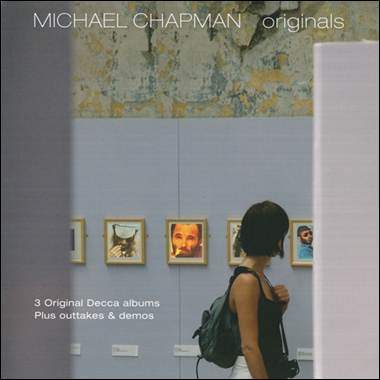 A person looking at pictures on a wall

Description automatically generated