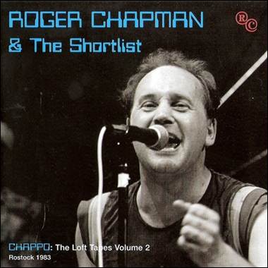 A person singing into a microphone
Description automatically generated