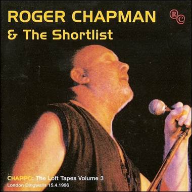 A person singing into a microphone
Description automatically generated