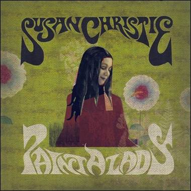 A person with long black hair and a red shirt
Description automatically generated