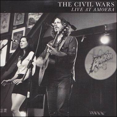 A person and person on stage
Description automatically generated