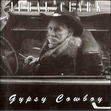 A person in a hat sitting in a car
Description automatically generated