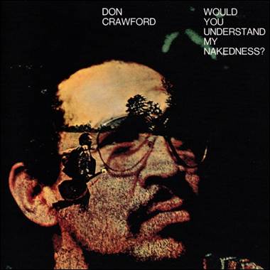 A person with a beard and glasses
Description automatically generated