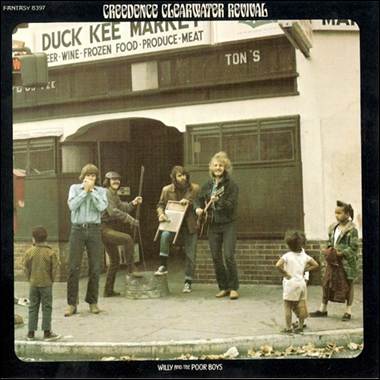 A group of people standing outside a building
Description automatically generated