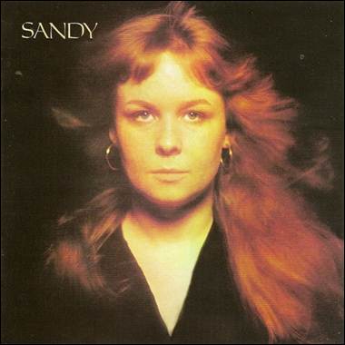 A person with long red hair
Description automatically generated