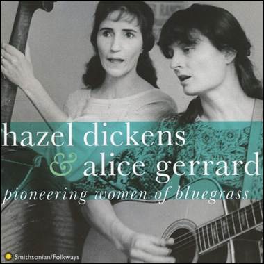 A person holding a guitar and another person holding a guitar
Description automatically generated