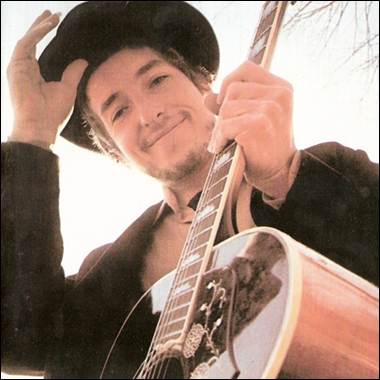 A person holding a guitar

Description automatically generated