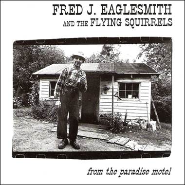 A person standing in front of a house

Description automatically generated