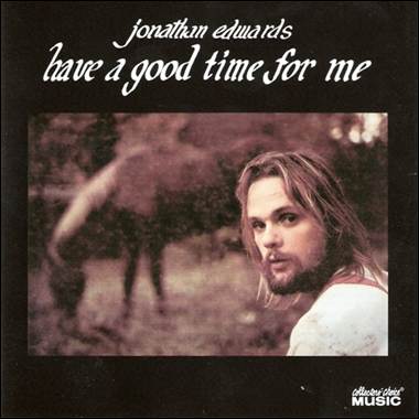 A person with long hair and a horse
Description automatically generated