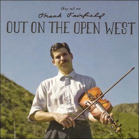 A person holding a violin
Description automatically generated