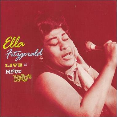 A person singing into a microphone
Description automatically generated