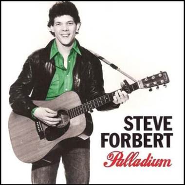 A person holding a guitar
Description automatically generated