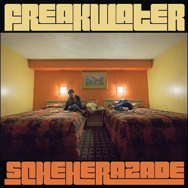 Two people sitting on two beds
Description automatically generated