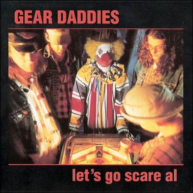 A group of people standing around a machine
Description automatically generated