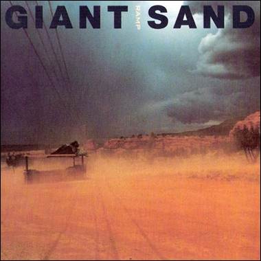 A large field with dirt and clouds
Description automatically generated with medium confidence