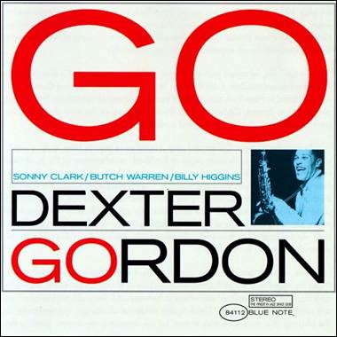 A white cover with red text and a person holding a guitar
Description automatically generated