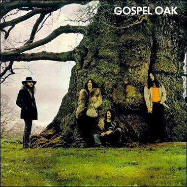 A group of people standing in front of a tree
Description automatically generated