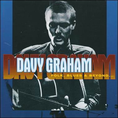 A person holding a guitar
Description automatically generated