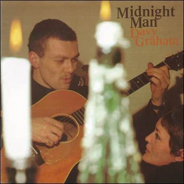 A person playing a guitar with a person
Description automatically generated