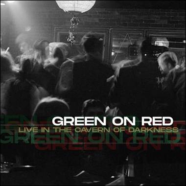 A group of people in a dark room
Description automatically generated