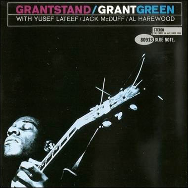 A person playing a guitar
Description automatically generated