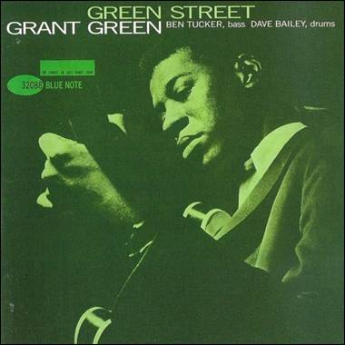 A person in a suit holding a microphone
Description automatically generated