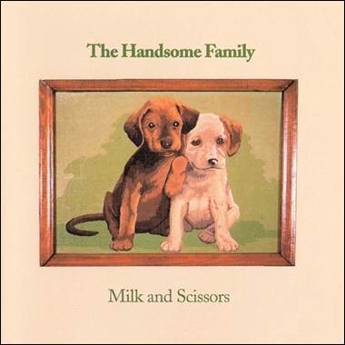 A picture of two dogs in a frame

Description automatically generated