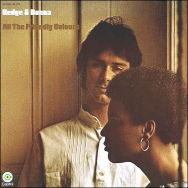 A person and person standing in front of a door
Description automatically generated