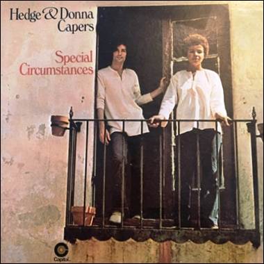 A person and person standing on a balcony
Description automatically generated