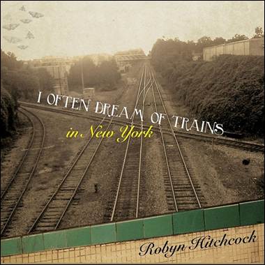 A train tracks in a rural area
Description automatically generated